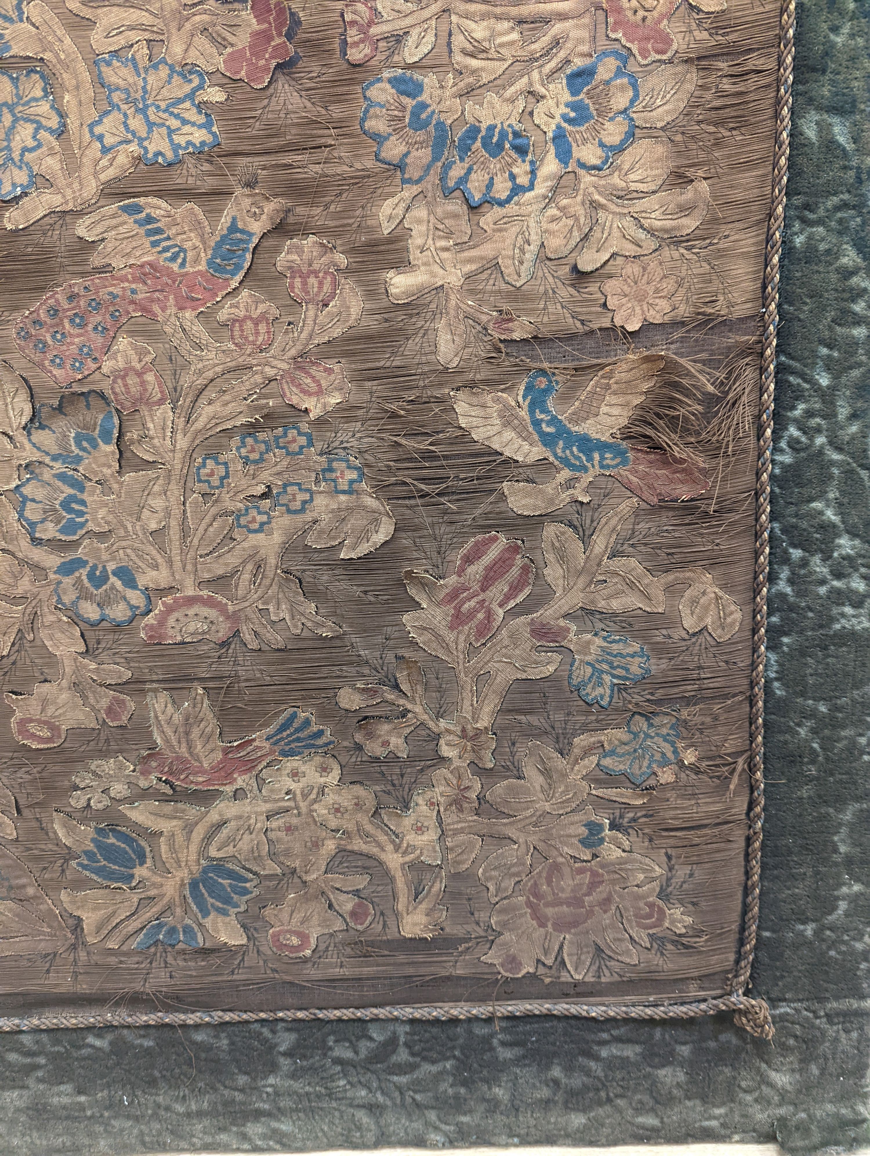A Charles II applique work ‘tree of life’ picture, 102 x 72cm incl. cut velvet edge